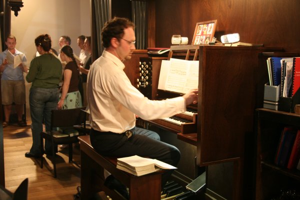 Organist and choir in the gallery