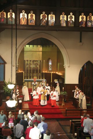 The Gospel procession moves into the body of the church